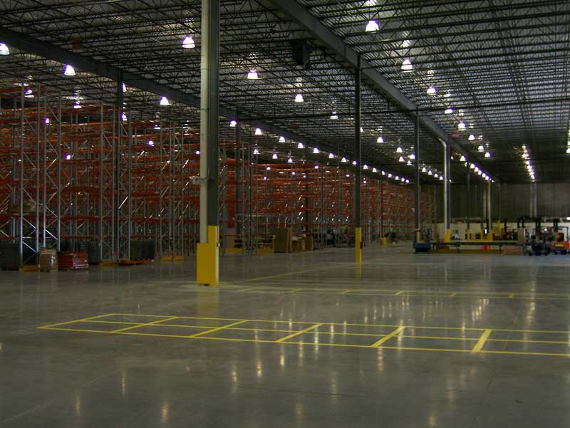 A dark empty warehouse in a newly constructed building.