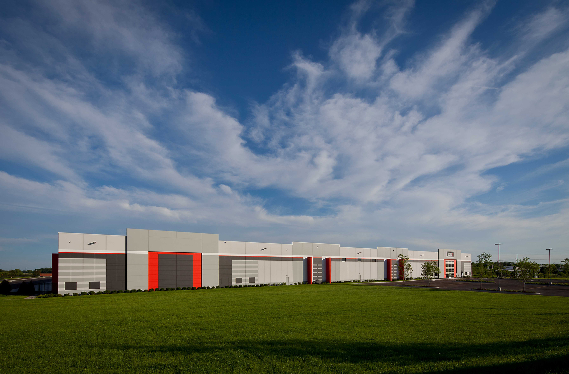 On a manicured lawn in the distance sits the 750,000 square foot Weber-Stephen Distribution Facility built by Keeley Construction, Inc.