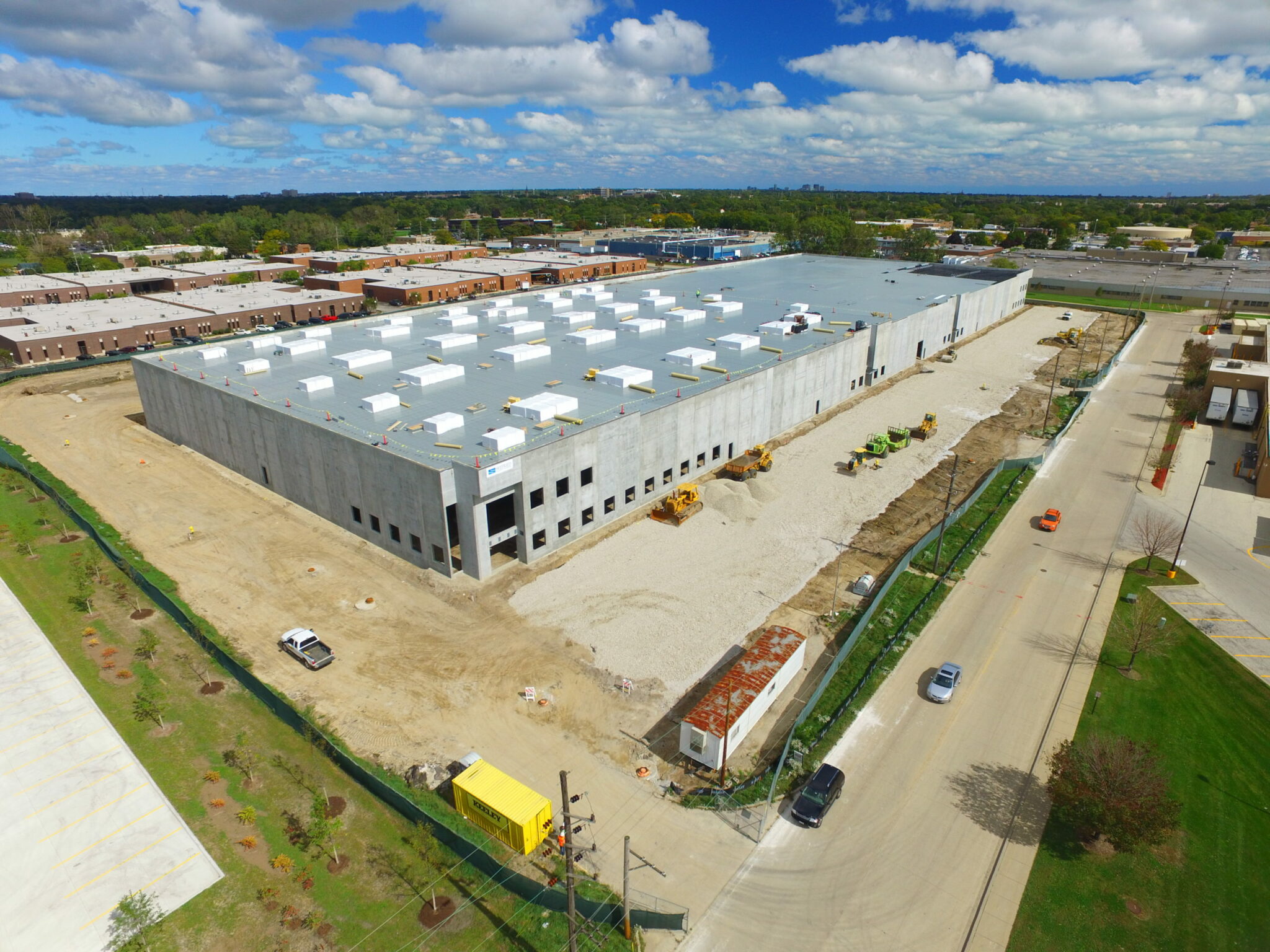 An aerial view of a large, newly constructed industrial building made by Keeley Constructions, Inc.