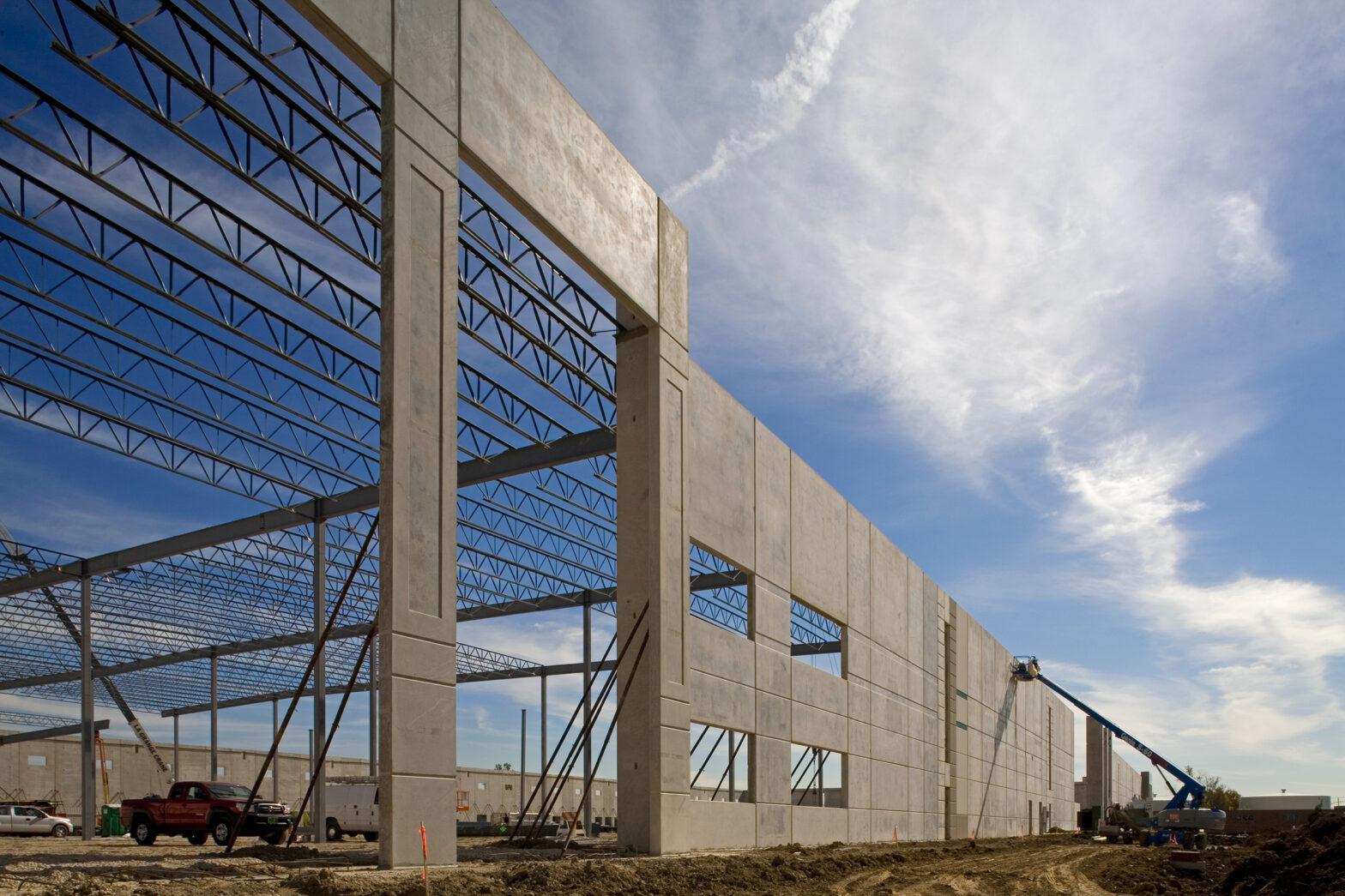 The skeleton of Kuehne & Nagel's 179,000 square foot building stands tall against a bright blue sky as construction continued by Keeley Construction, Inc.