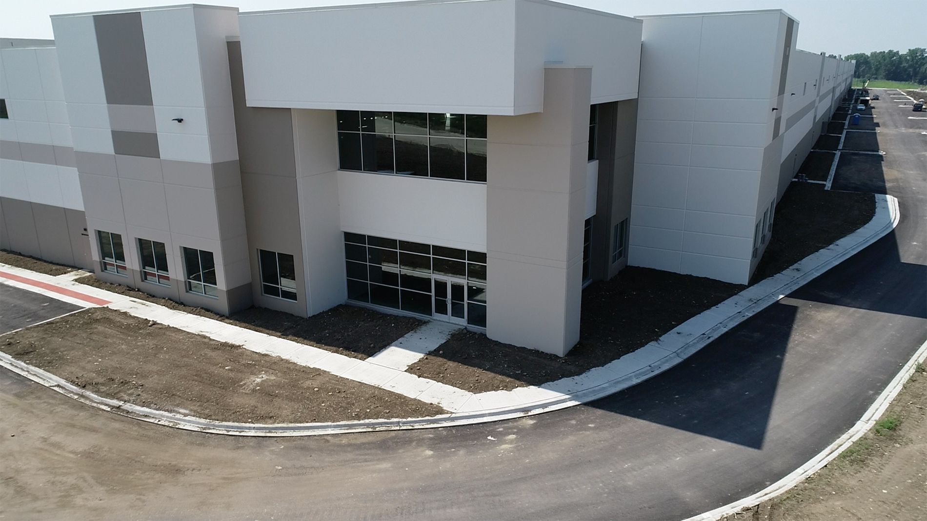 The white walkway to the entrance of a new center built by Keeley Construction, Inc.