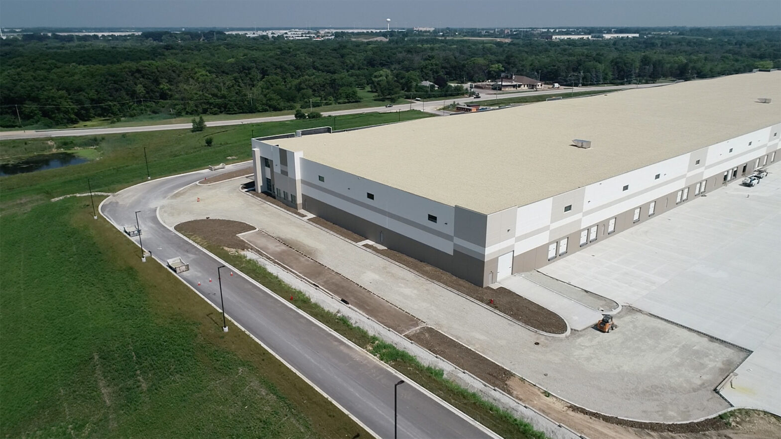 An aerial view of the First Joliet Logistics Center, a white industrial building.