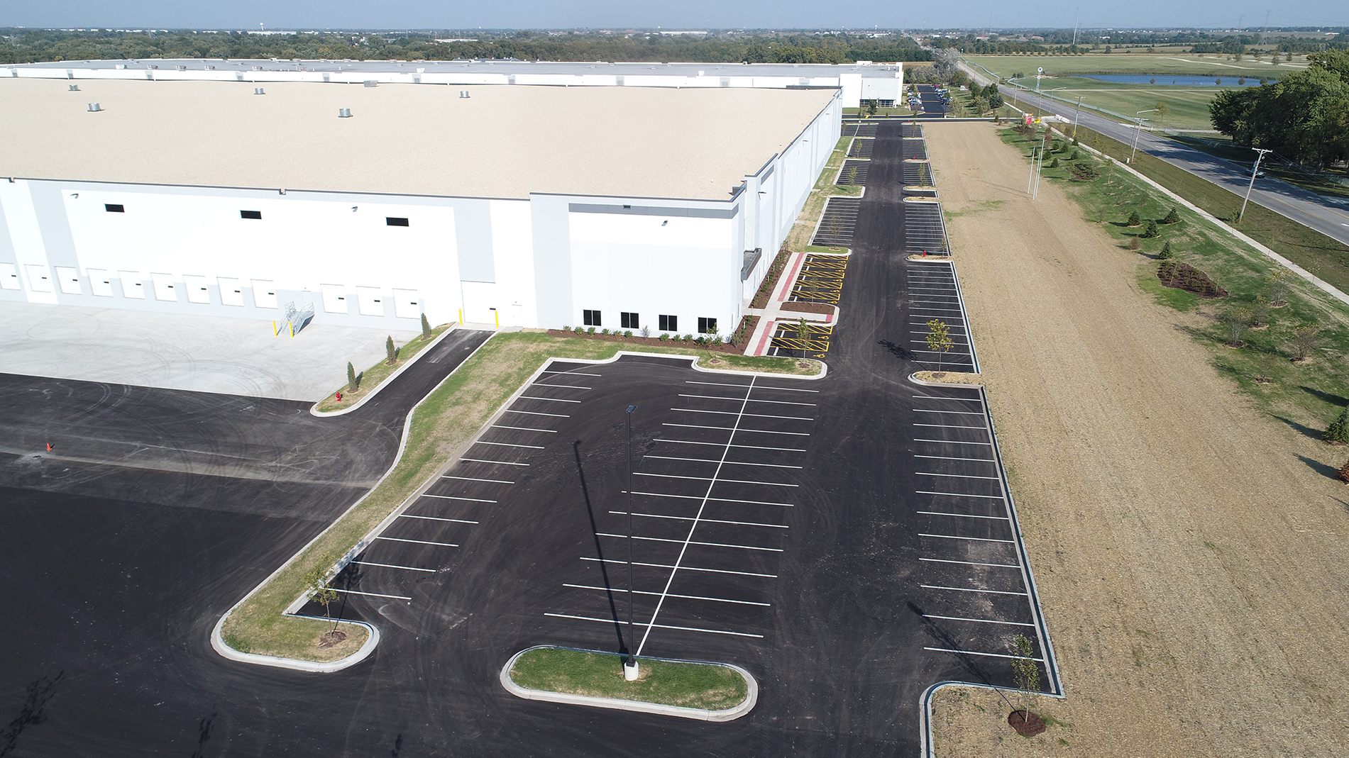 The DHL warehouse and distribution center's large parking lot.