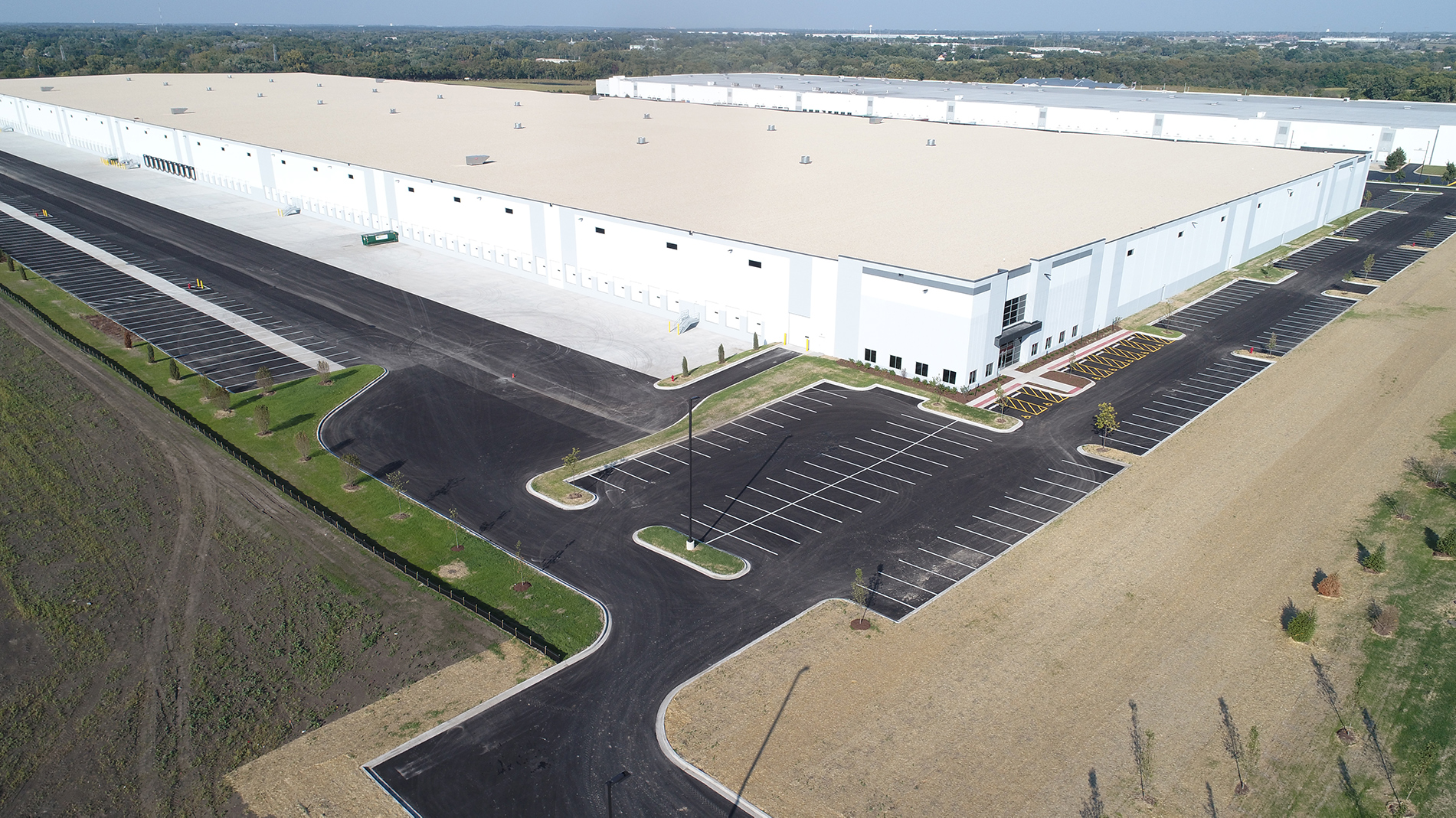 A bird's eye view of the white walls and roof of the DHL warehouse