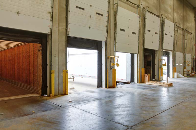 A view of open bay doors for shipping and receiving in the Zones' warehouse.